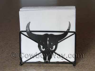 A napkin holder with a steer head design.