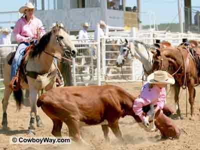 A picture of two cowgirls in the tie down event at a women's ranch rodeo