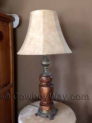 Faux leather lamp shade on a wooden, hand-lathed lamp