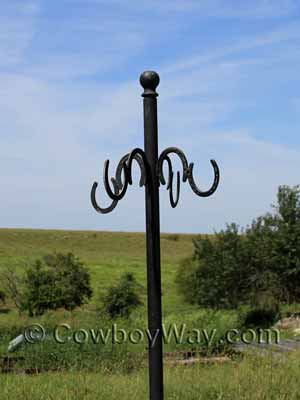 A bridle rack with horseshoe hangers