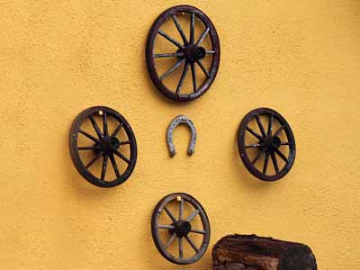 Wagon wheels hung on a wall as decor