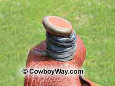 A roping/ranch saddle with its horn wrapped in rubber