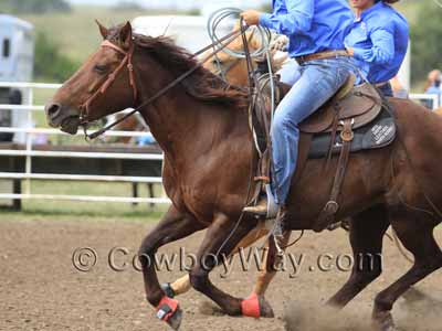 Red bell boots at a ranch rodeo