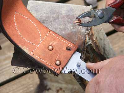 Pulling rivets out with a pair of pliers