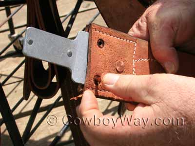 Insert new copper rivets into the stirrup leather and Blevins buckle