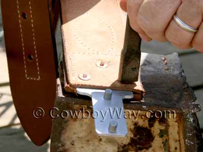 Use the rivet and burr setter tool and a hammer to peen the rivets