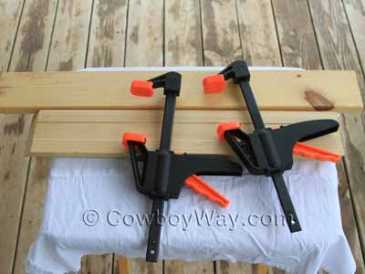 Two boards and two C clamps