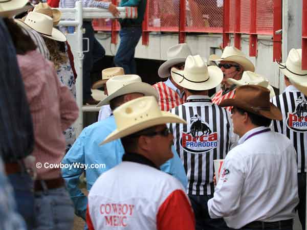Officials behind the chutes at the 
Cheyenne Frontier Days Rodeo