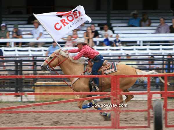 A Cheyenne Dandie carries a sponsor flag