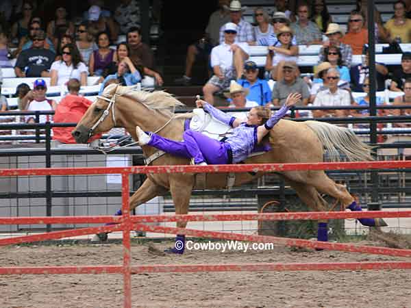 A trick rider on the racetrack at The Cheyenne Frontier Days Rodeo
