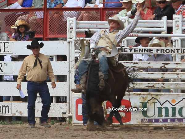 A bronc leaves the bucking chute