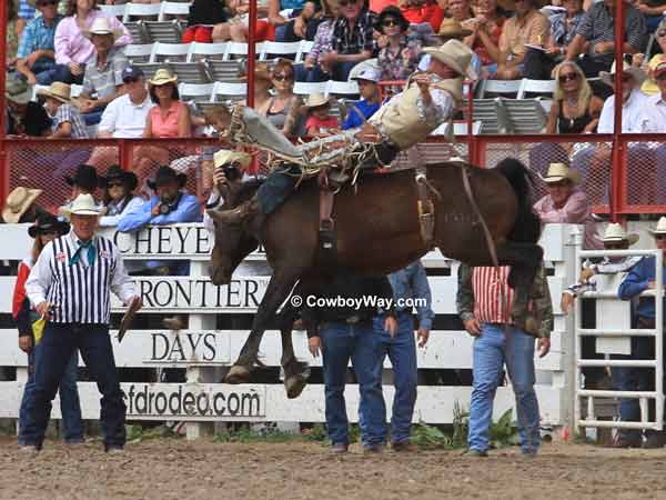 A bareback bronc springs into the air