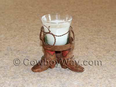 A small cowboy candle holder