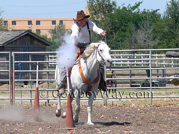 A cowboy mounted shooter shoots the balloon target