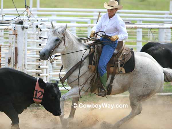 A cowgirl in the sorting event