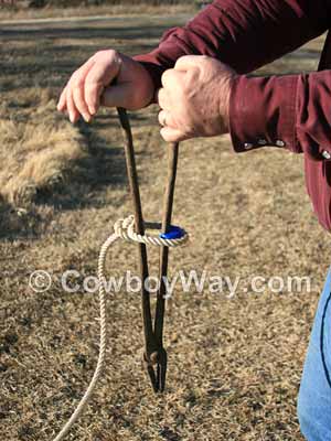 Using a long handled tool to pry a speed burner onto a honda