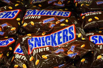 Several packages of Snickers Miniature candy bars