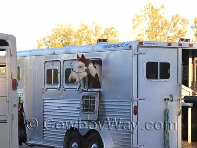 A horse trailer without a window screen