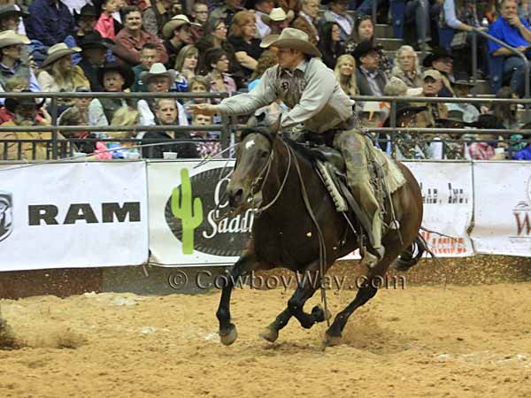 A member of the ranch rodeo team ropes their stray