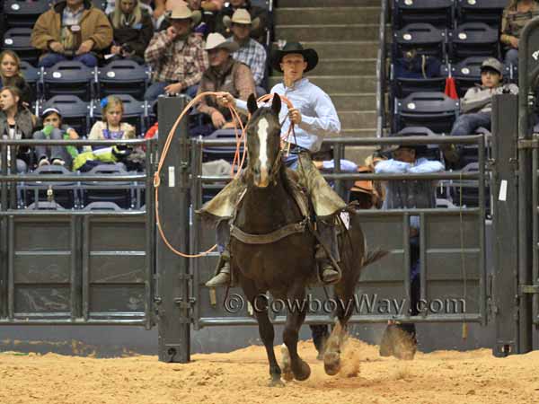 Troy Higgs waits on his horse to rope his team's cow