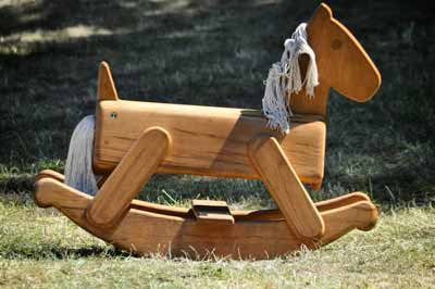 A modern, small wood rocking horse
